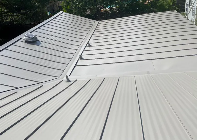 Solar attic fan installed on a metal roof for Roof Ventilation in Southern Pines